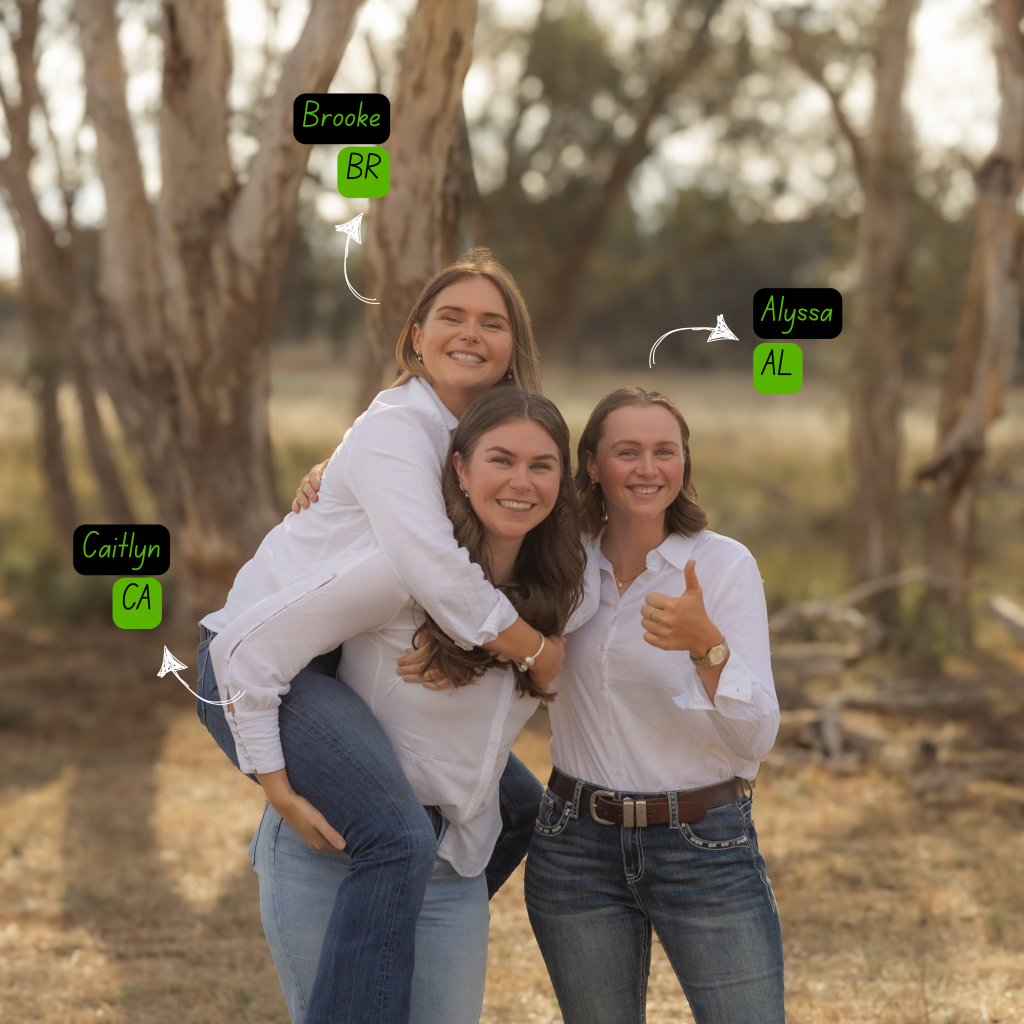 A picture of three girls smiling at the camera. Alyssa has her thumbs up. Brooke is hanging off Caitlyn's back.